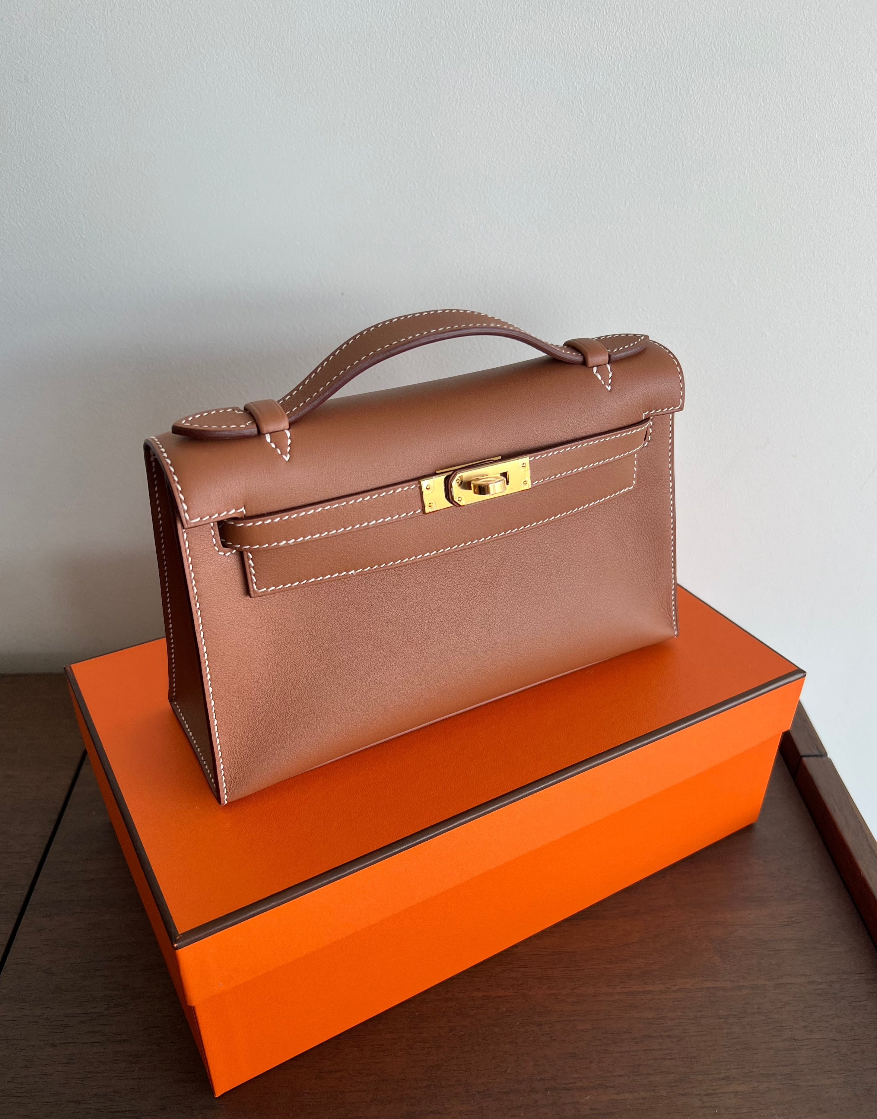 Hermès Kelly Pochette Gold Swift GHW